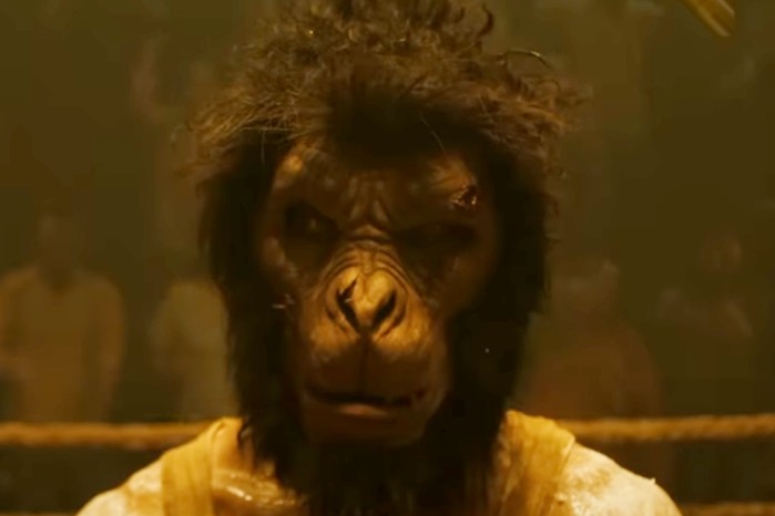 Dev Patel as Kid in Monkey Man.  He wears a monkey mask that covers his real face