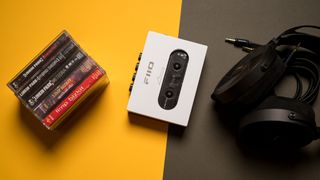 Fiio CP13 cassette player with cassettes alongside