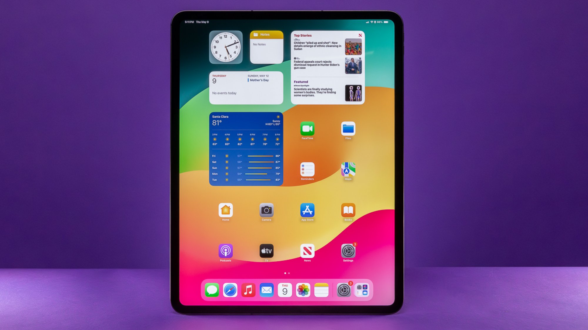 13-inch iPad Pro in front of a purple background in portrait mode