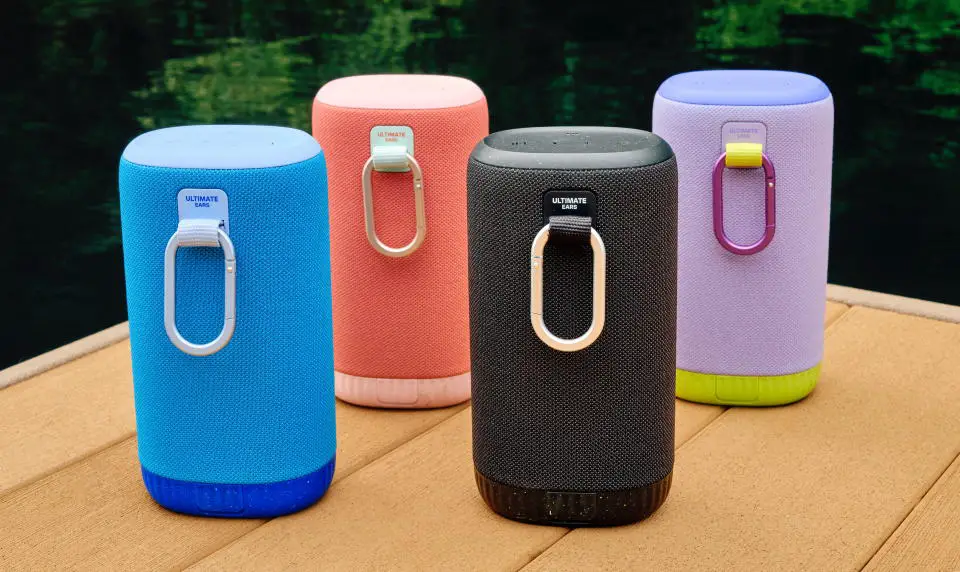 Ultimate Ears Everboom speakers in several colors with carabiner clips.