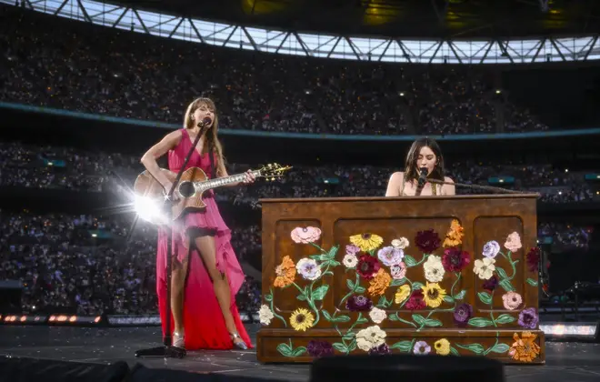 Taylor Swift and Gracie Abrams perform on stage during the Eras Tour at Wembley Stadium
