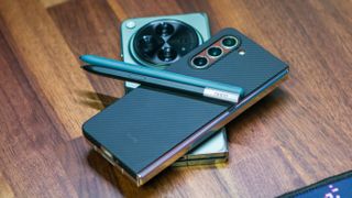 Samsung Galaxy Z Fold 5 stacked on OnePlus Open with S Pen and Oppo Pen
